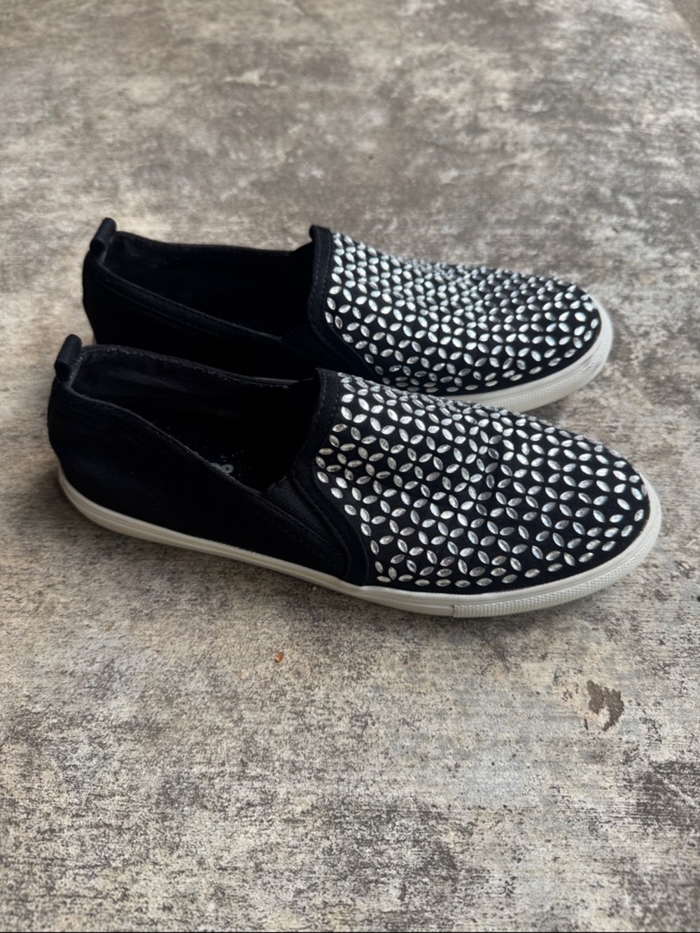 Carlos by Carlos Santana Black Slip-On Sneakers with Silver Petal Studs